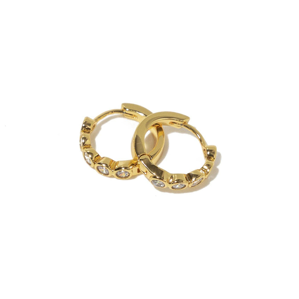 B. Grands 18K Gold Round Brilliant Huggies